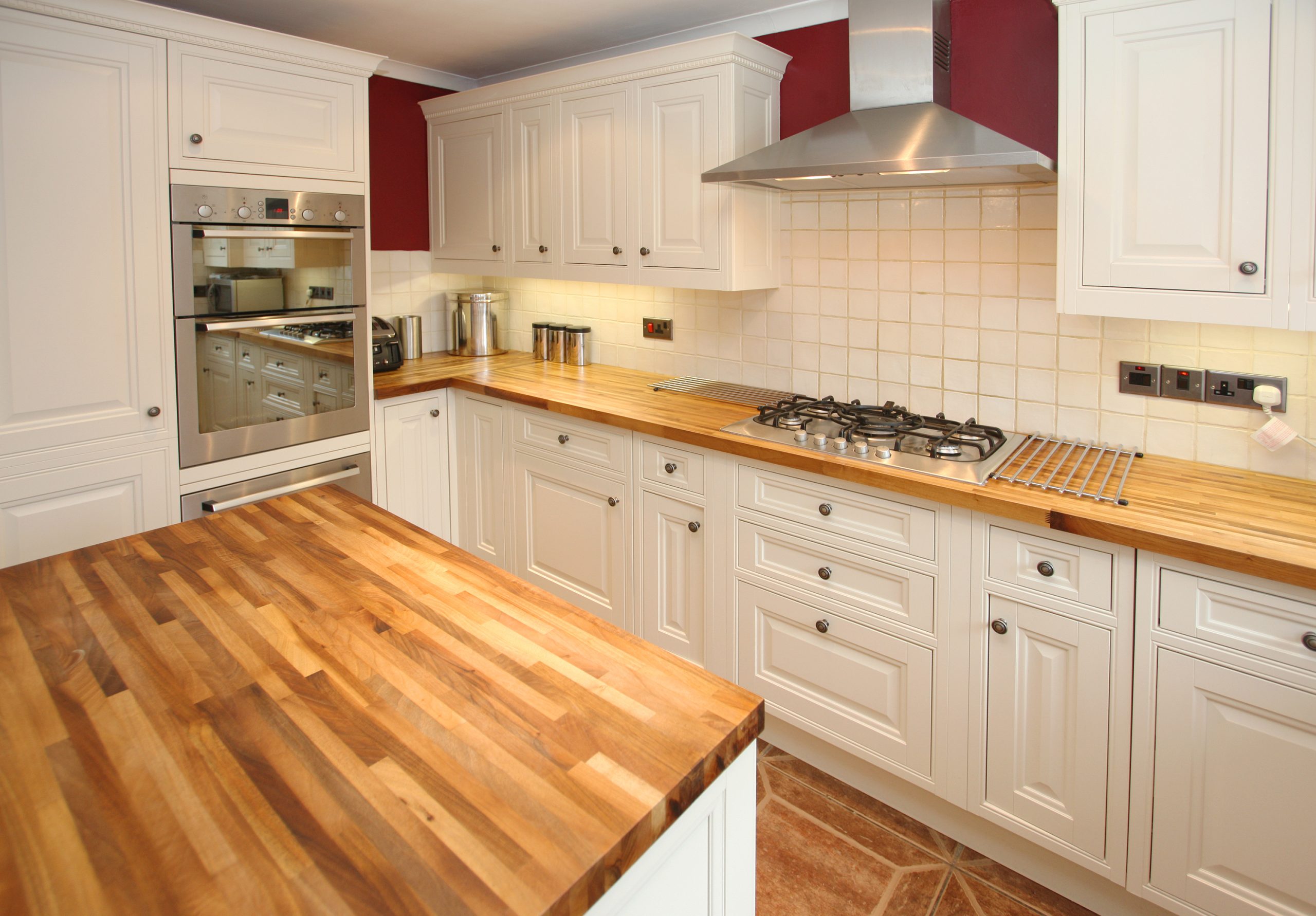 Worktop Refinishing in Bracknell on restored oak butcher block kitchen worktops with rustic ceramic tile flooring